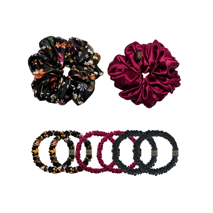 Set of two large scrunchies and eight small hair ties. The large scrunchies include one in a black floral pattern and one in burgundy satin. The small hair ties feature a mix of black, burgundy, and floral patterns, arranged in a row.