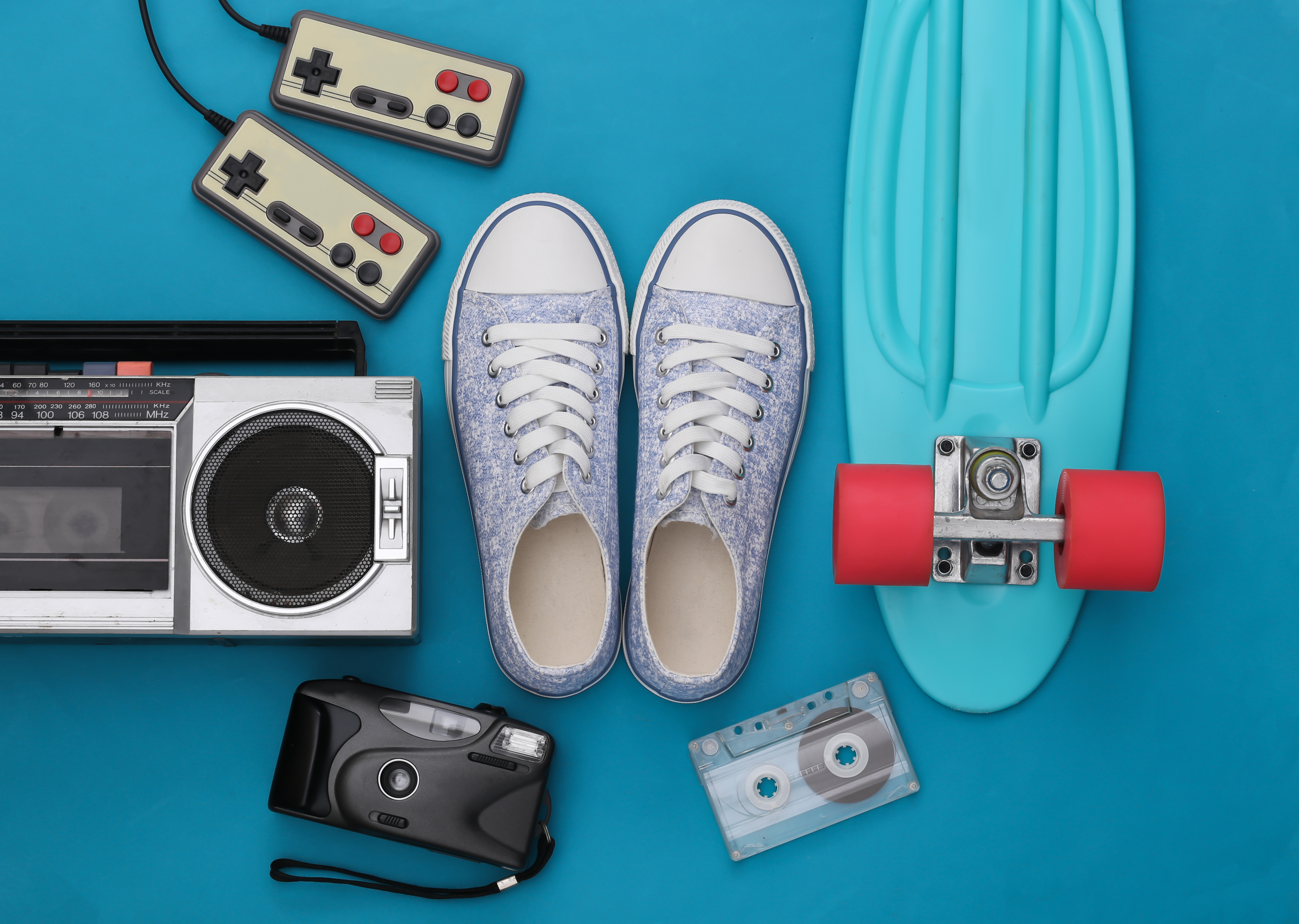 Retro old school attributes 80s on blue background. Top view. Flat lay