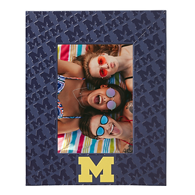 A photo frame with the college your graduate is going to, in this picture, the University of Michigan is featured on a Navy blue frame with darker blue Ms and a yellow M a the bottom. 
