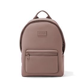 A beige leather backpack by Dagne Dover. 