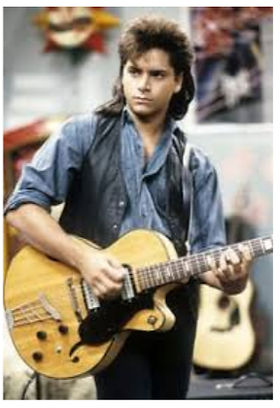 John Stamos as Uncle Jesse on Full House.