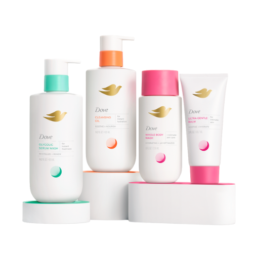 Four Dove skincare products, including Glycolic Serum Wash, Cleansing Oil, Whole Body Wash, and Ultra Gentle Balm, displayed on a white surface with colorful pumps and caps.