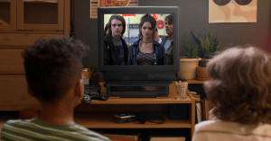 Kids watching iconic 90s horror movies.