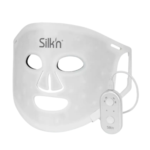A flexible silicone Silk’n LED Face Mask 100 displayed flat, showing its eye cutouts and embedded LED light panels.