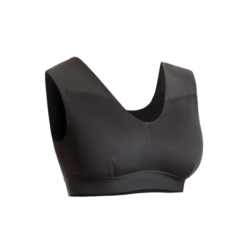 A Tommie Copper women’s athletic bra featuring a smooth, supportive design with wide straps and structured shaping, shown in a simple product display.