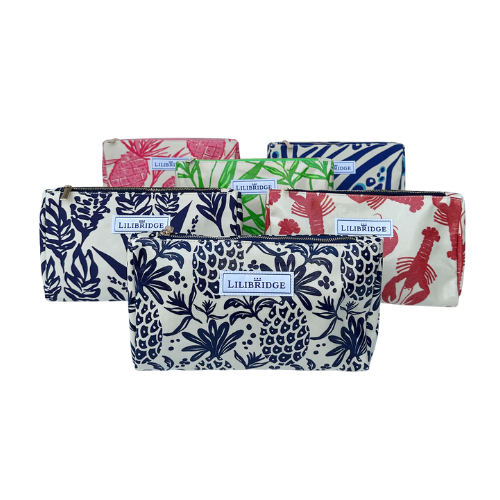 A collection of colorful LILIBRIDGE zipper pouches featuring tropical patterns, displayed in various colors including pink, green, and navy.
