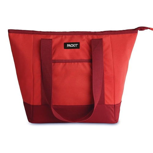Red insulated tote bag from PackIt with dark red bottom and handles, featuring a front pocket and the brand label 'PACKIT'.