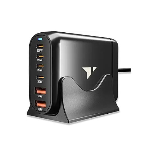 A sleek black multi-port USB charger with six outputs, labeled with various power ratings, resting in a stand.