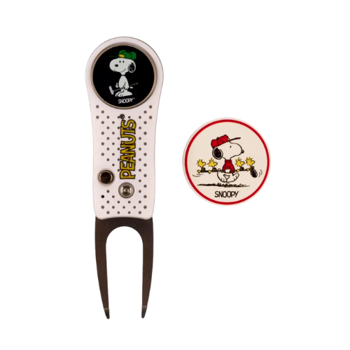 Snoopy-themed golf divot repair tool with a ball marker featuring Snoopy and Woodstock.