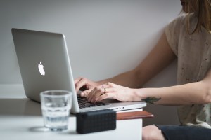 Woman at desk discovering financial confidence.