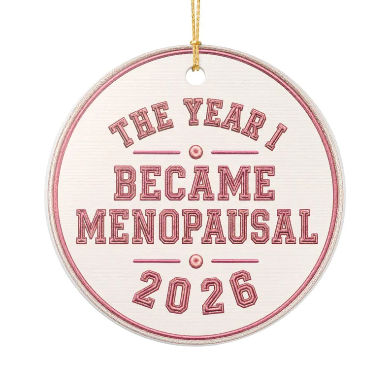 Circular ornament reading 'The Year I Became Menopausal 2026' in decorative lettering.